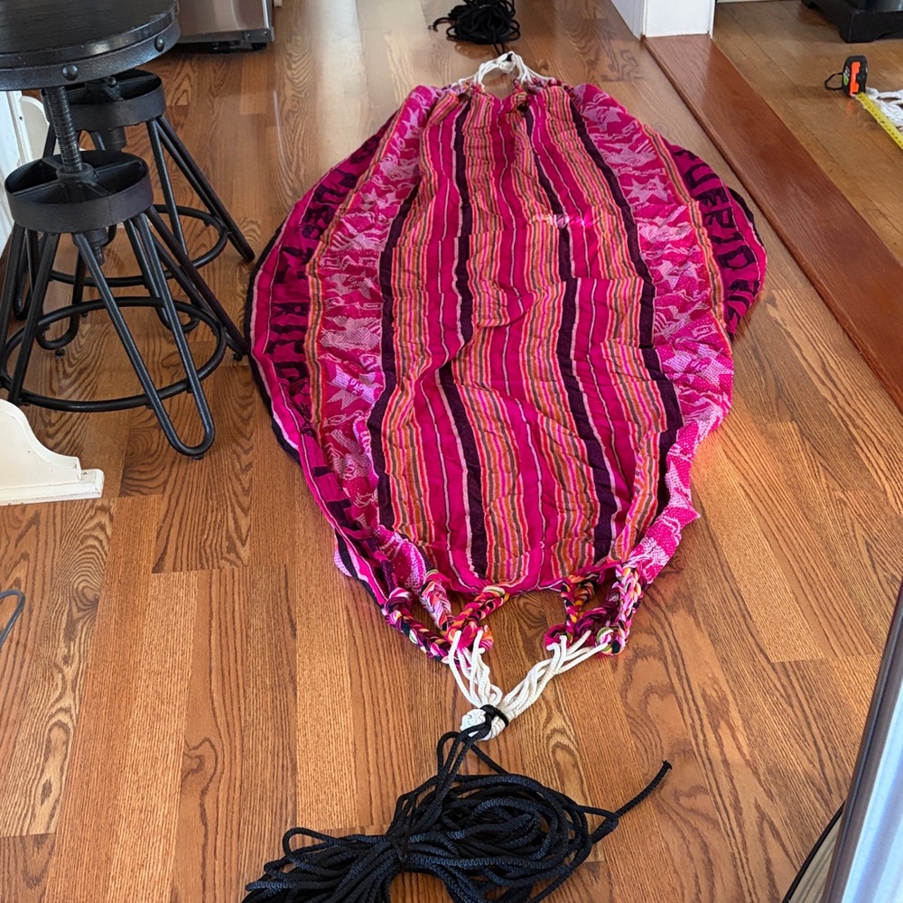 Vibrant Pink and Red Striped Hammock includes rope leads to tie to poles or tree